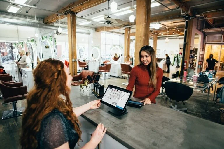 two women in bussiness talking to each other