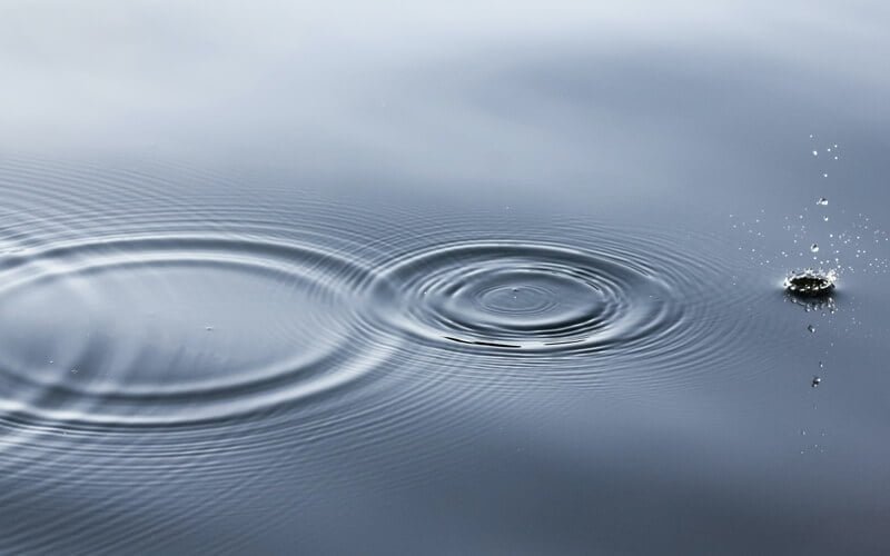 drop falling into water and forming circles